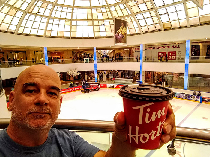 DJ Peace enjoys Tim Hortons coffee at West Edmonton Mall above Ice Park 08-09-19 Awesome Entertainment Travel Blog